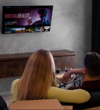 Couple streaming a film at home through NordikTV in Canada